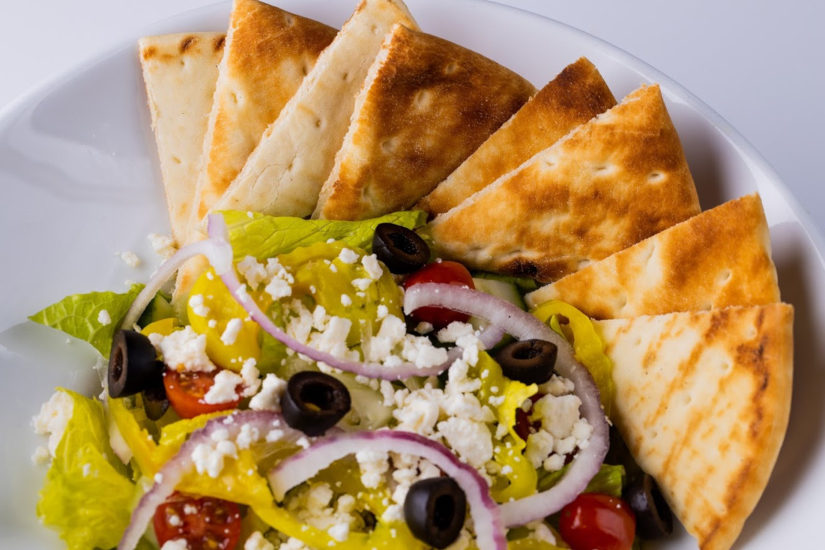 salad with cottage cheese, olives, onions and triangle bread